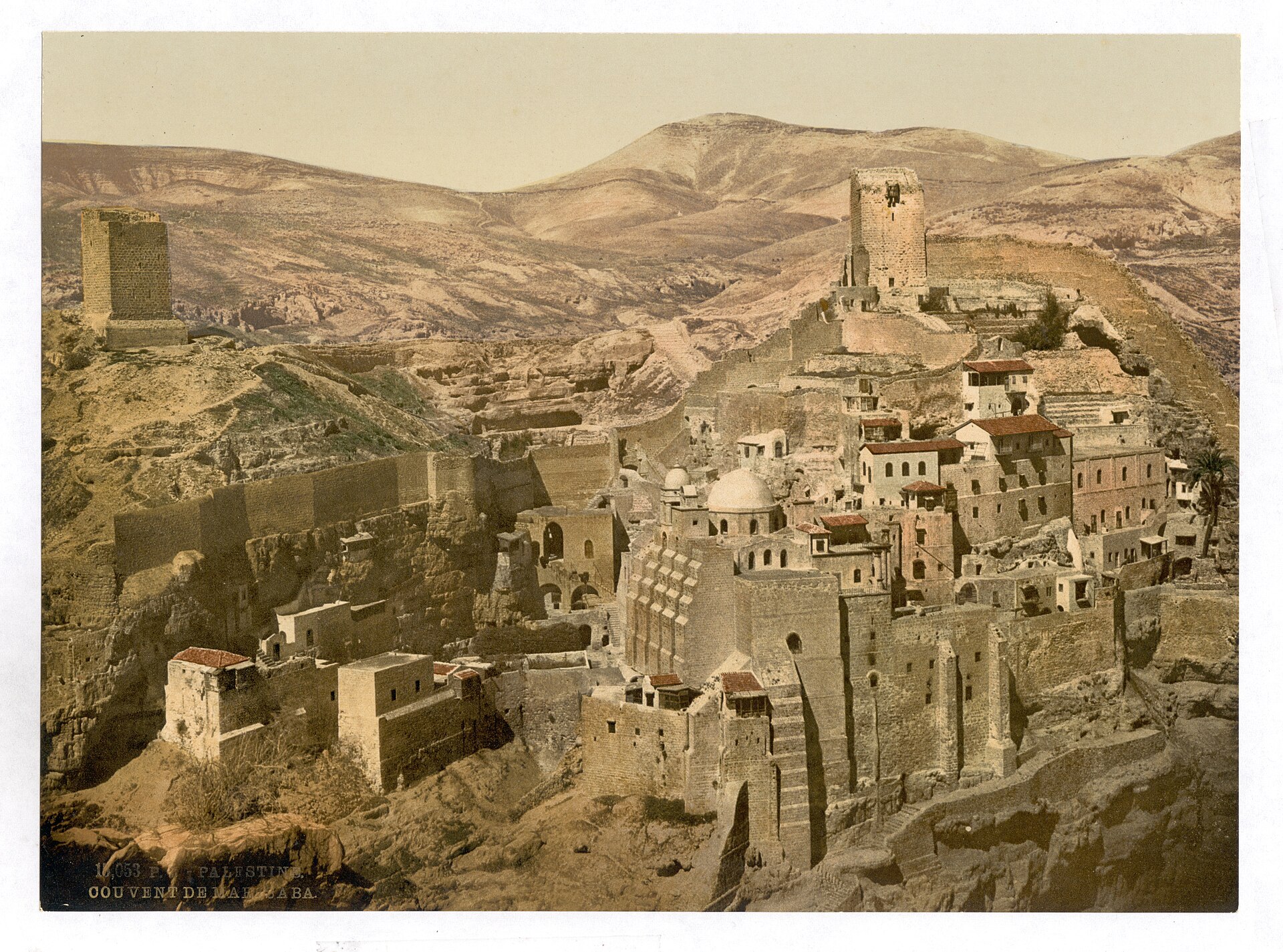 Mar Saba monastery built into the cliffs of the Kidron Valley, hand-colored photograph from the 1890s
